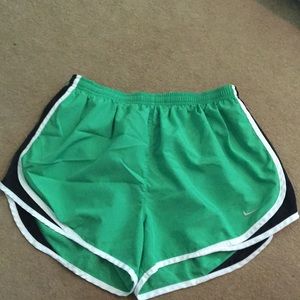Green Nike running shorts